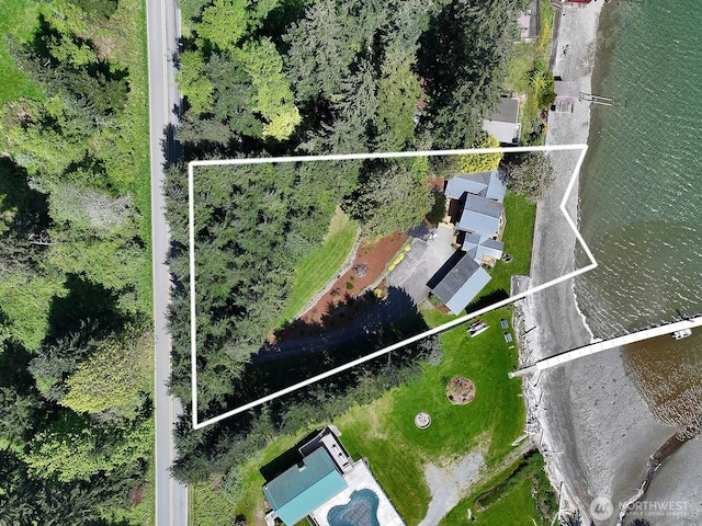 birds eye view of property with a water view