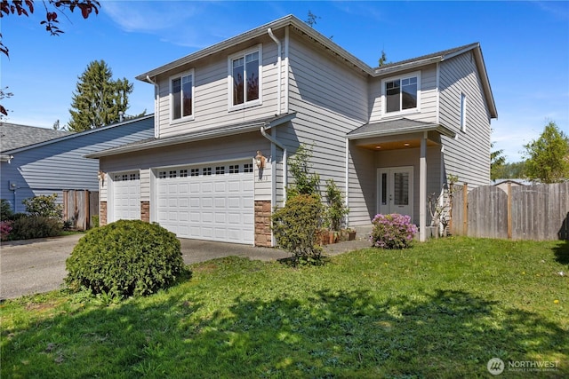 traditional home with a front lawn, stone siding, concrete driveway, fence, and a garage