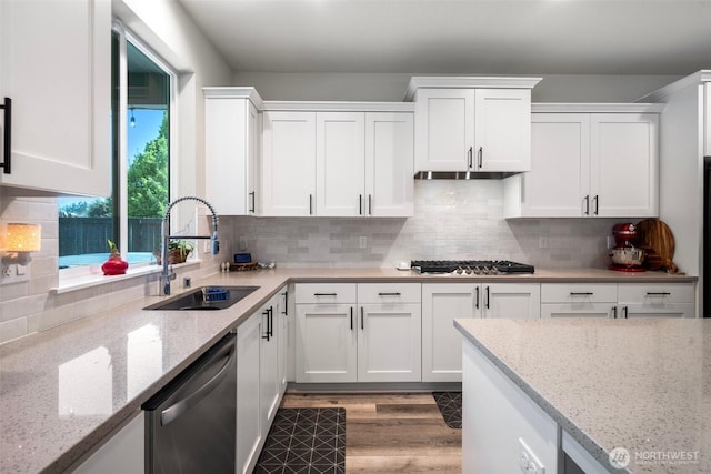 8852 N 5th St, Ridgefield, WA 98642 - kitchen with a sink, light wood-style floors, white cabinetry, light stone countertops, and appliances with stainless steel finishes