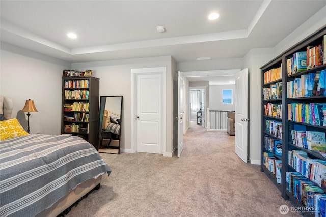 8852 N 5th St, Ridgefield, WA 98642 - bedroom with baseboards, a raised ceiling, light carpet, and recessed lighting