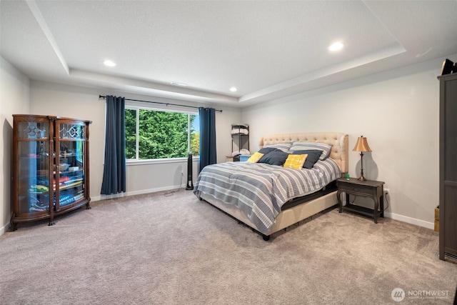 8852 N 5th St, Ridgefield, WA 98642 - bedroom with a tray ceiling, recessed lighting, baseboards, and light colored carpet