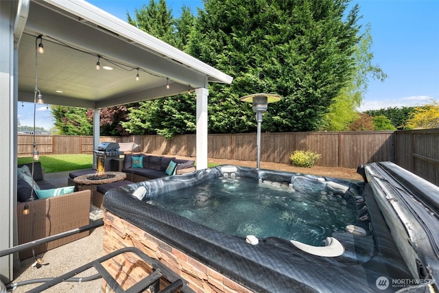8852 N 5th St, Ridgefield, WA 98642 - view of patio featuring an outdoor living space with a fire pit, a hot tub, and a fenced backyard