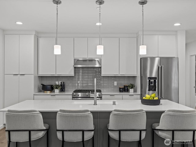 15528 NE 15th Pl Unit 201, Bellevue, WA 98007 - kitchen with appliances with stainless steel finishes, wall chimney range hood, modern cabinets, white cabinets, and an island with sink