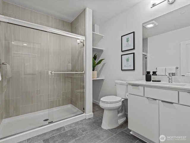 15528 NE 15th Pl Unit 201, Bellevue, WA 98007 - full bath with a stall shower, toilet, vanity, and tile patterned floors
