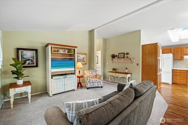 23825 15th Ave SE Unit 180, Bothell, WA 98021 - living area featuring light wood-style flooring, lofted ceiling, and baseboards
