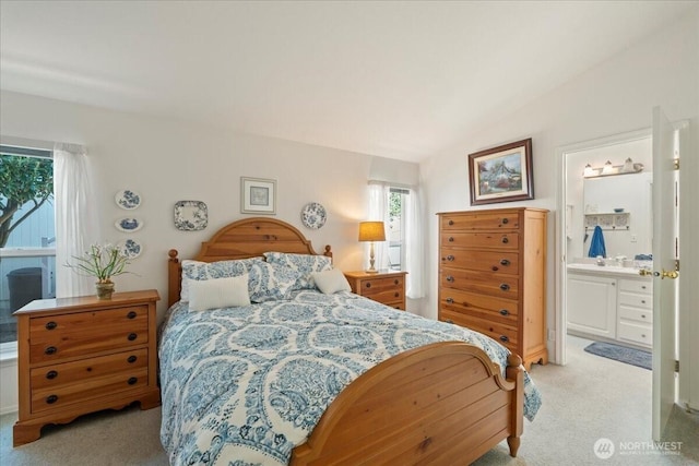 23825 15th Ave SE Unit 180, Bothell, WA 98021 - bedroom featuring vaulted ceiling, ensuite bath, and light carpet
