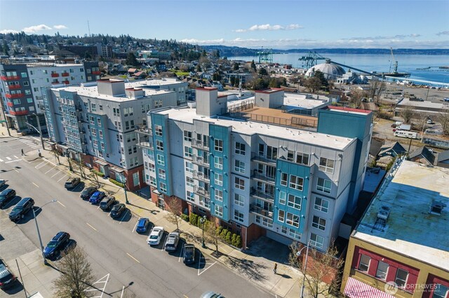 birds eye view of property with a water view