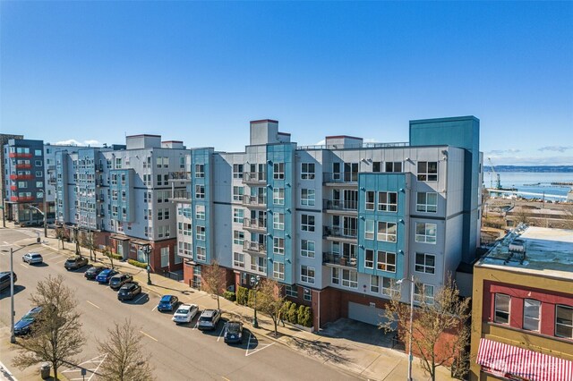 view of property featuring uncovered parking