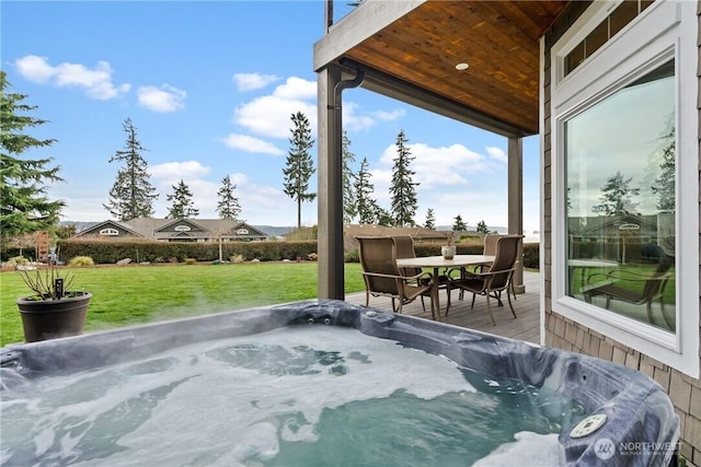 view of patio featuring a hot tub and outdoor dining space