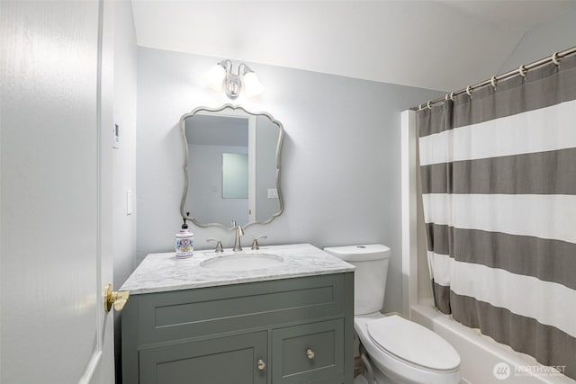 full bathroom with lofted ceiling, vanity, toilet, and shower / tub combo
