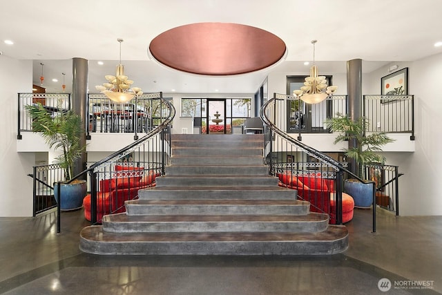 323 Queen Anne Ave N Unit 508, Seattle, WA 98109 - staircase featuring concrete flooring, a chandelier, and recessed lighting