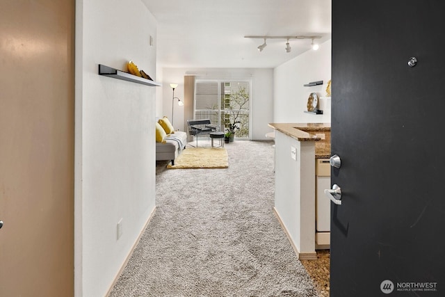 323 Queen Anne Ave N Unit 508, Seattle, WA 98109 - hall with carpet floors and rail lighting