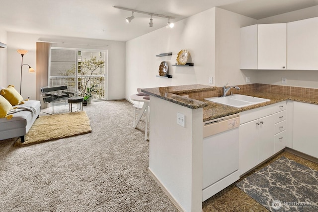 323 Queen Anne Ave N Unit 508, Seattle, WA 98109 - kitchen with a sink, white cabinets, dishwasher, and carpet flooring