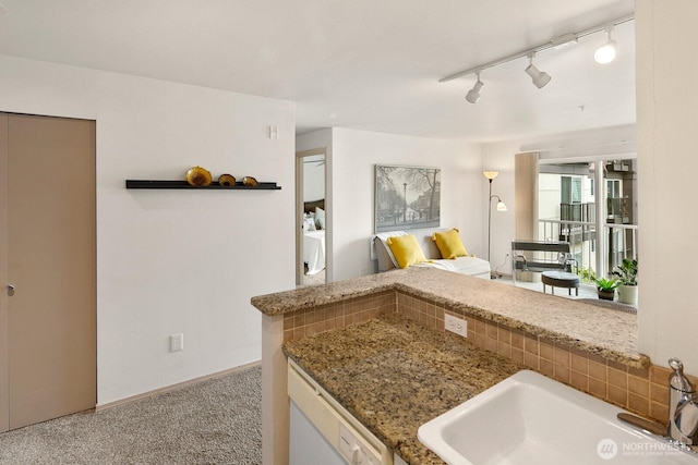 323 Queen Anne Ave N Unit 508, Seattle, WA 98109 - kitchen featuring a sink, dishwasher, carpet, open floor plan, and stone counters