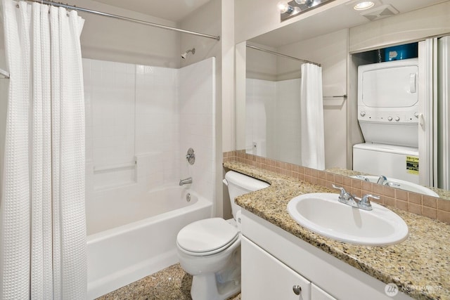 323 Queen Anne Ave N Unit 508, Seattle, WA 98109 - full bathroom featuring vanity, stacked washer and dryer, toilet, and shower / bath combo with shower curtain