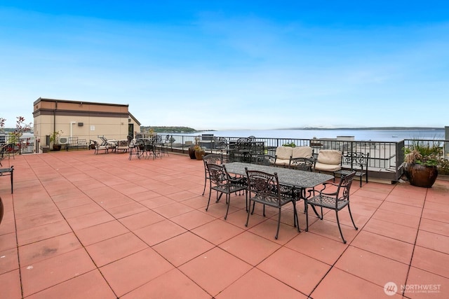 323 Queen Anne Ave N Unit 508, Seattle, WA 98109 - view of patio / terrace with outdoor dining area and a water view