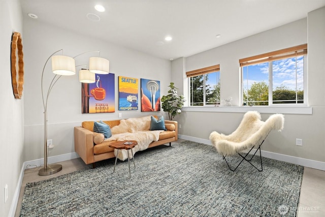 sitting room featuring baseboards and recessed lighting
