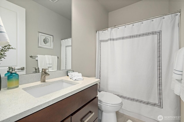 full bathroom featuring vanity, tile patterned floors, toilet, and a shower with curtain