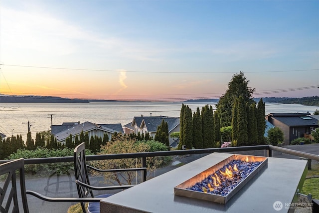 view of water feature with an outdoor fire pit