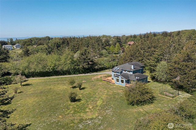 aerial view featuring a wooded view