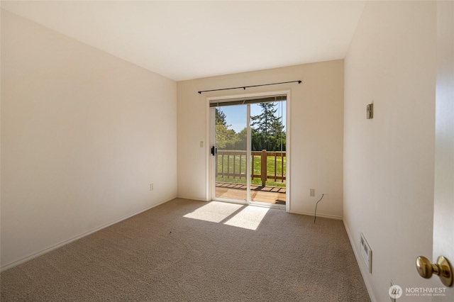 spare room with visible vents and carpet floors