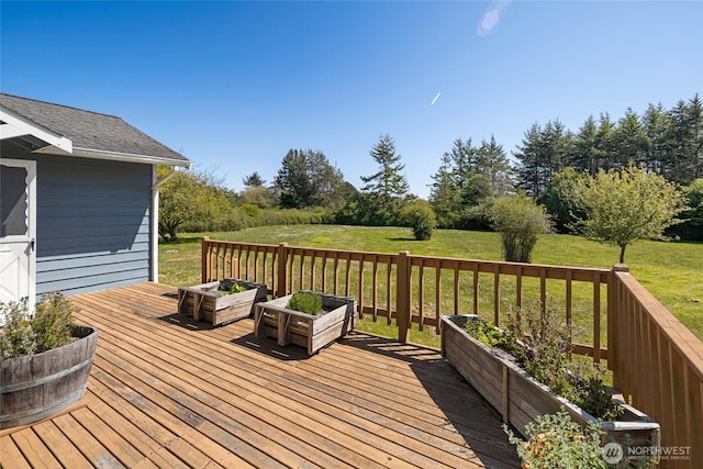 wooden terrace with a yard