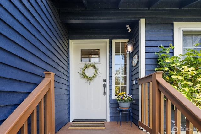 entrance to property featuring covered porch