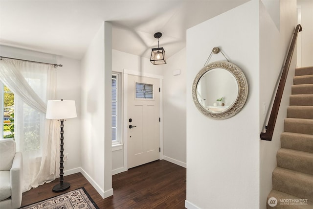 entryway with baseboards, dark wood-style flooring, and stairs