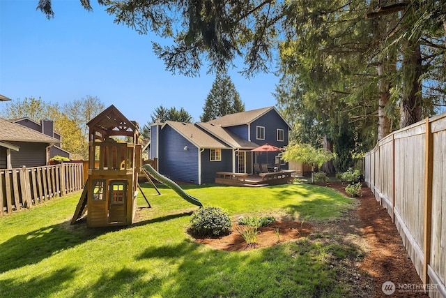 exterior space with a fenced backyard and a playground