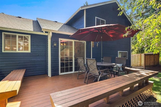 wooden deck featuring outdoor dining area