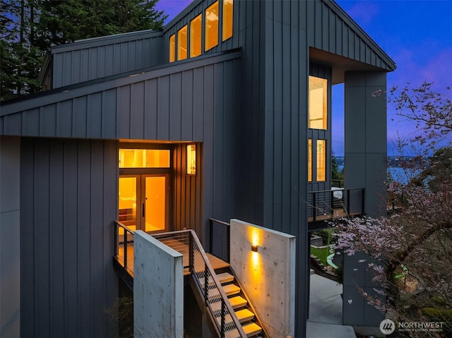 5340 W Mercer Way, Mercer Island, WA 98040 - property exterior at dusk with board and batten siding and stairs