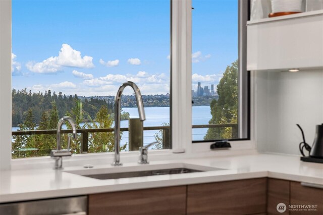 5340 W Mercer Way, Mercer Island, WA 98040 - kitchen featuring a sink, stainless steel dishwasher, a water view, and light countertops