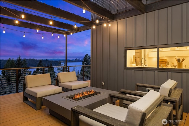 5340 W Mercer Way, Mercer Island, WA 98040 - wooden terrace featuring a fire pit and a water view