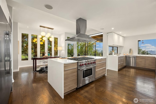 5340 W Mercer Way, Mercer Island, WA 98040 - kitchen featuring modern cabinets, stainless steel appliances, island range hood, dark wood-style floors, and light countertops
