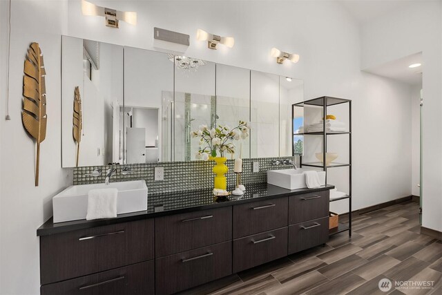 5340 W Mercer Way, Mercer Island, WA 98040 - bathroom featuring tasteful backsplash, double vanity, wood finished floors, baseboards, and a shower