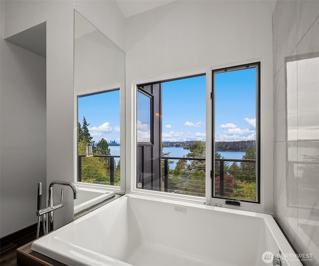 5340 W Mercer Way, Mercer Island, WA 98040 - bathroom with a water view, a freestanding bath, and wood finished floors