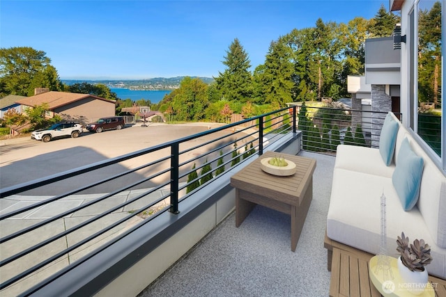 balcony featuring a water view