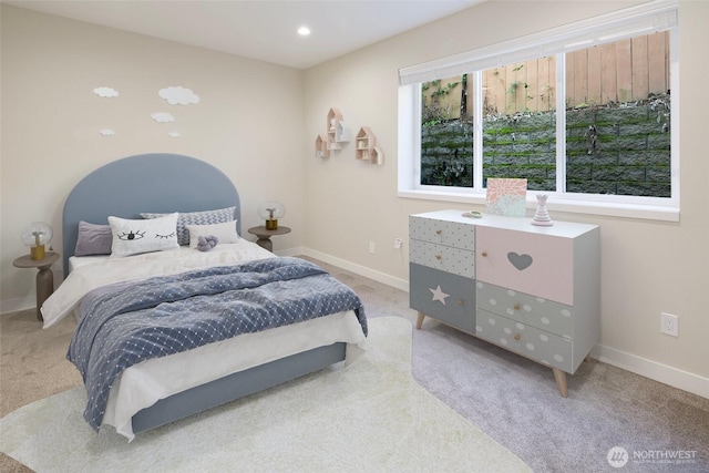 bedroom featuring baseboards and carpet