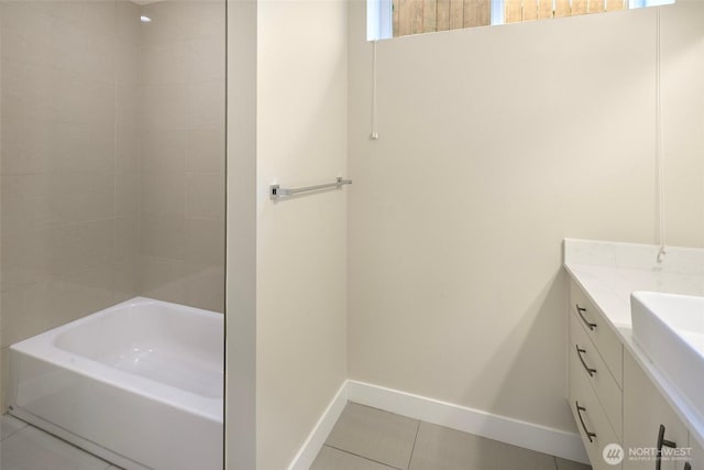 full bath with a washtub, tile patterned flooring, a shower, baseboards, and vanity