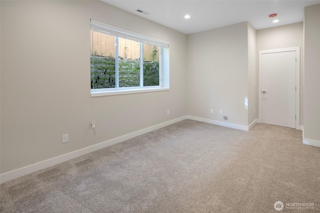 unfurnished room with baseboards, recessed lighting, visible vents, and light carpet