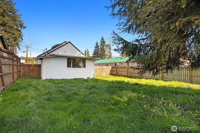 view of yard with a fenced backyard