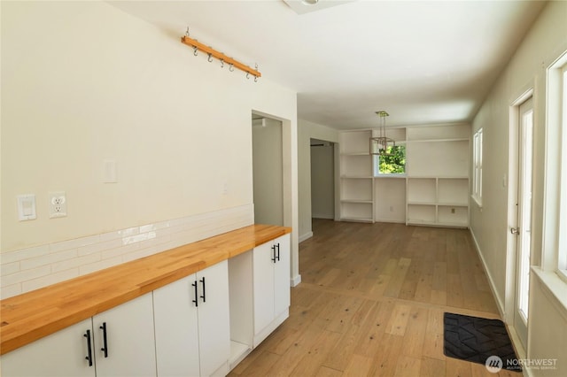 hallway featuring light wood-type flooring