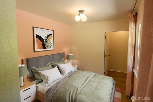 bedroom featuring wood finished floors