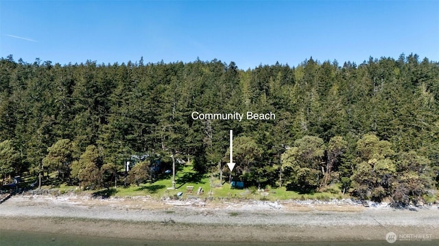 birds eye view of property with a view of trees