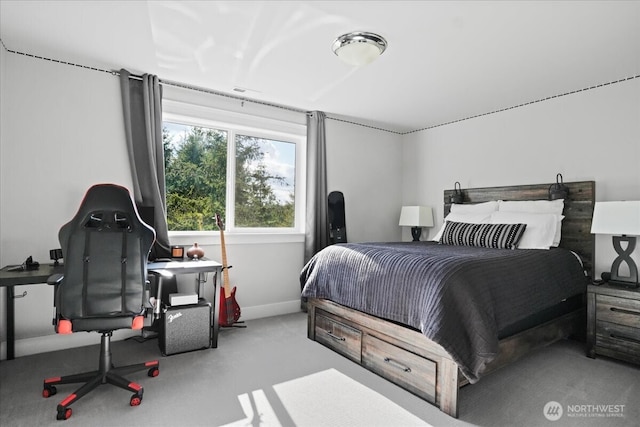 bedroom featuring baseboards and carpet