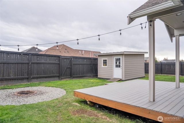 1509 Seahawk Dr, Ferndale, WA 98248 - view of yard featuring a fenced backyard, a fire pit, a wooden deck, and a gate