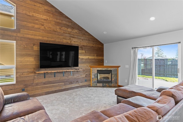 1509 Seahawk Dr, Ferndale, WA 98248 - carpeted living room featuring recessed lighting, high vaulted ceiling, wood walls, and a tile fireplace