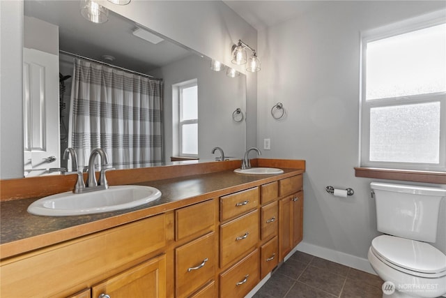 1509 Seahawk Dr, Ferndale, WA 98248 - full bath with a sink, tile patterned flooring, toilet, and double vanity