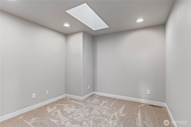 1509 Seahawk Dr, Ferndale, WA 98248 - empty room with a skylight, carpet floors, baseboards, and recessed lighting