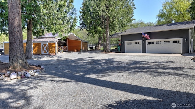 exterior space with driveway and an exterior structure